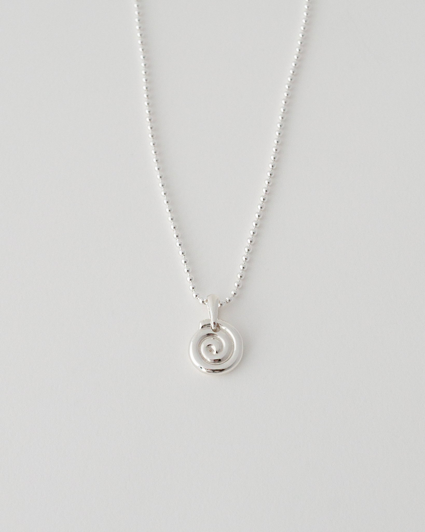 EXISTENTIAL SWIRL NECKLACE
